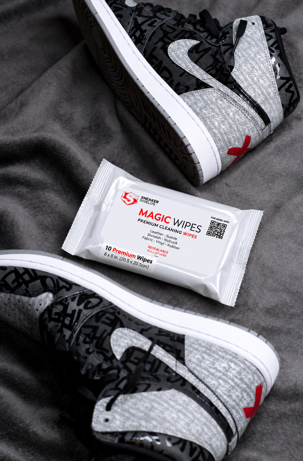 Magic Wipes pack styled flat lay between a pair of black and grey high-top sneakers